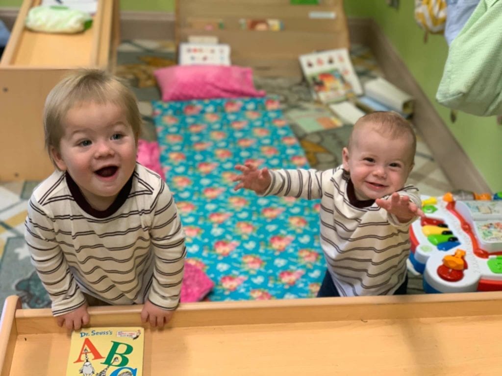 Blonde toddler boys smiling